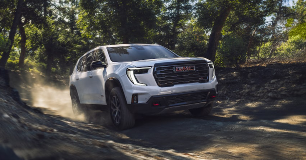 2025 GMC Acadia Driving through the forest