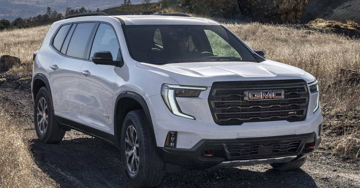 2025 GMC Acadia driving through wet terrain